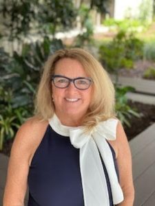 Women smiling outside, headshot Collier Insurance