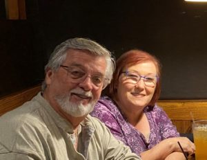 Man and wife sitting at a table
