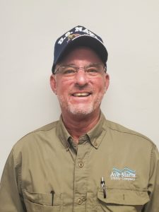 Man in hat smiling at camera